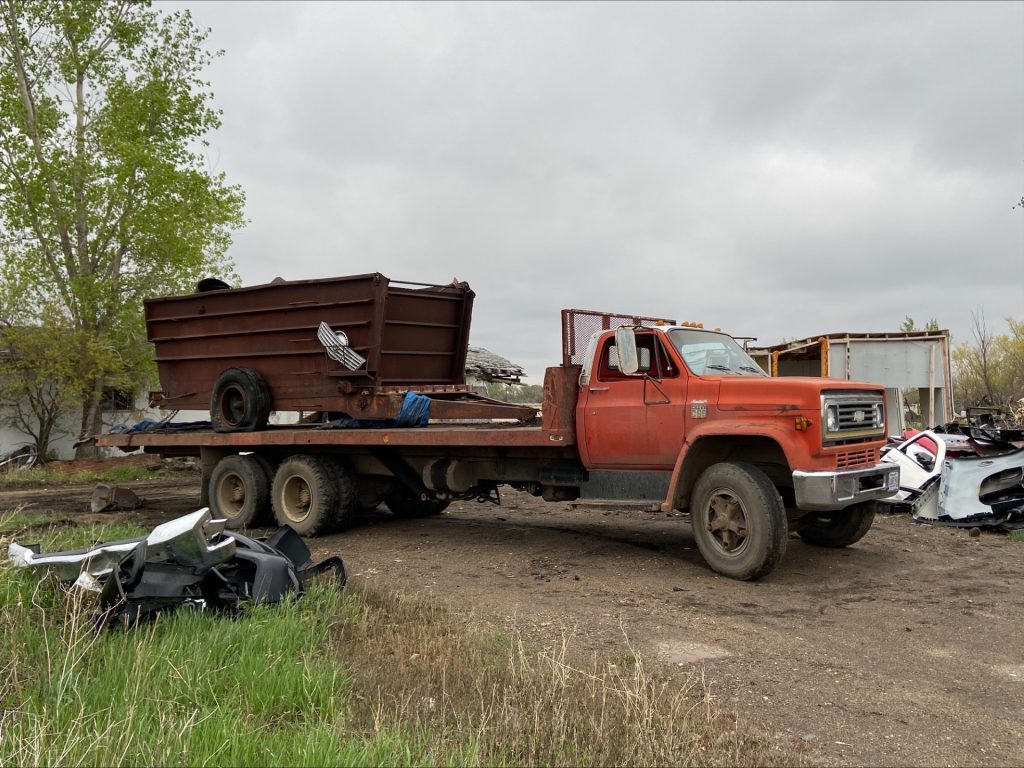 Scrap dumpster on truck bed